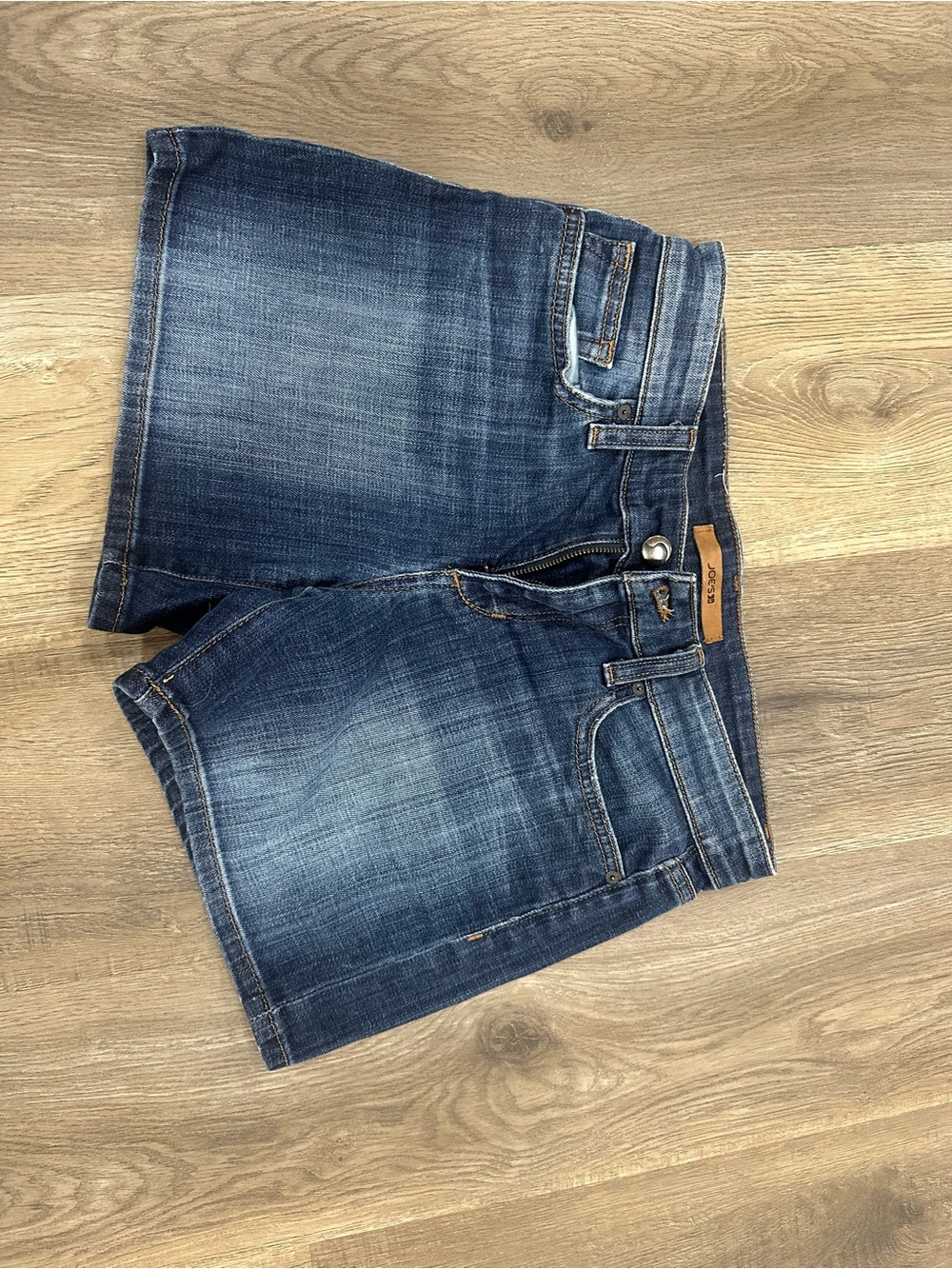 Joe's Jeans light blue denim shorts with tan label